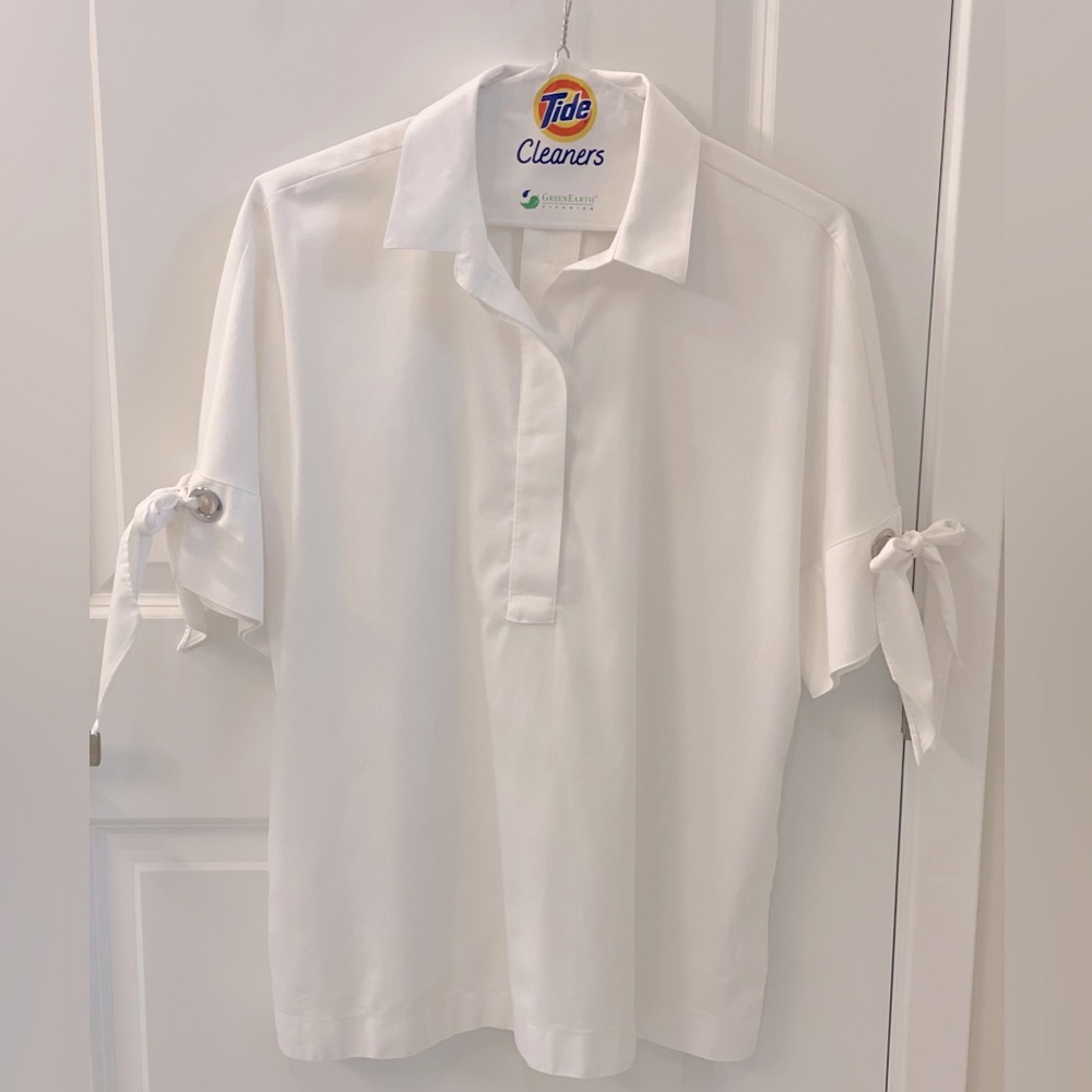 Chicos White Blouse NWOT! size 2 w/bow sleeves. Non-wrinkle material! Never worn